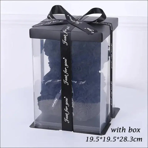 Caja de regalo con tapa oscura y cinta negra, ideal para Oso de Rosas en San Valentín
