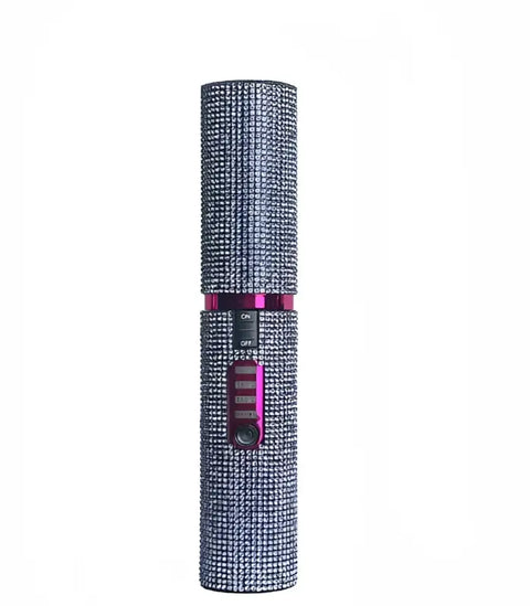 Alarma personal de seguridad cubierta de piedras con control y sección rosa para tu cabello