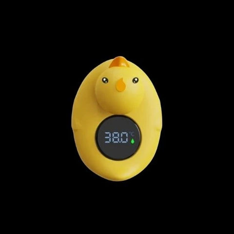 termómetro amarillo con forma de pollito.