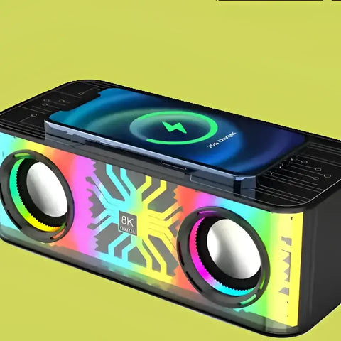 Altavoz Bluetooth Portátil con Micrófono y teléfono cargándose sobre él