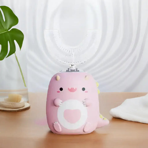 Cepillo de dientes eléctrico para niños en forma de dinosaurio rosa para cuidar los dientes