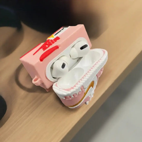 funda auriculares rosa con temática de nike.