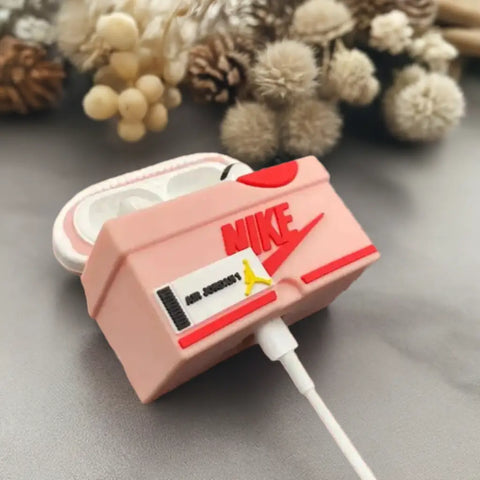 Funda AirPods Zapatillas de electronica con diseño de zapatilla rosa y audio moderno