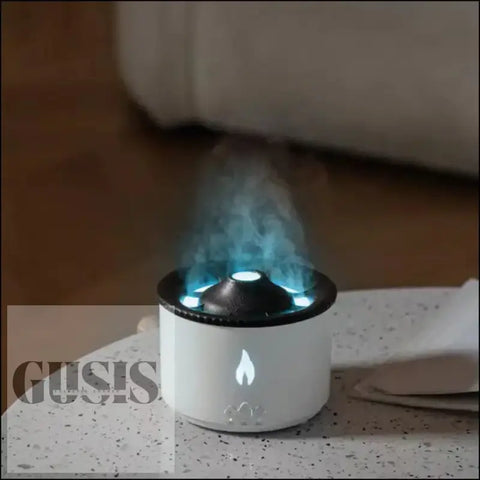 Humidificador emitiendo vapor azul, ideal para aromaterapia con aceites esenciales