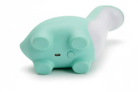 Luz nocturna dinosaurio en forma de gato de silicona verde menta y blanca con luz suave
