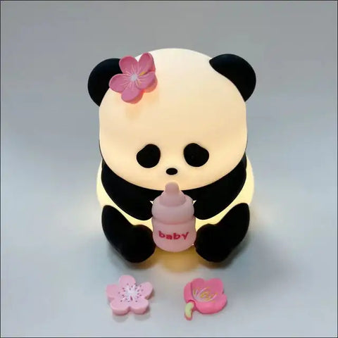 Lámpara de Noche Panda iluminada con biberon y flores