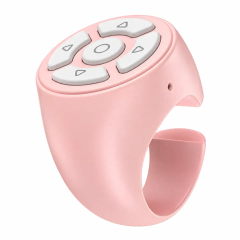 Mando bluetooth de anillo rosa de silicona con botones blancos para reproducción multimedia y uso con sola mano