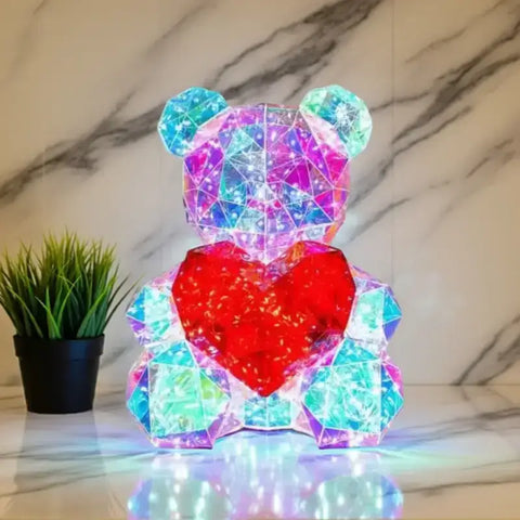 Osito LED Color Spark con efecto iridiscente y corazón rojo, ideal para decoración